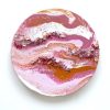 Participant painting colourful abstract paint pouring at Fresh Paint Studio Toronto