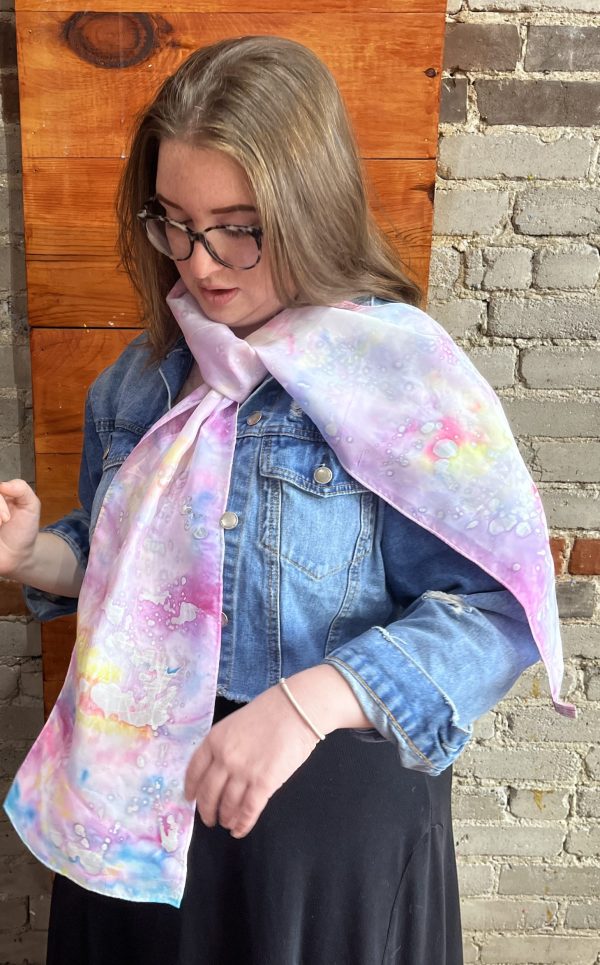 Participant painting colourful abstract silk scarf at Fresh Paint Studio Toronto