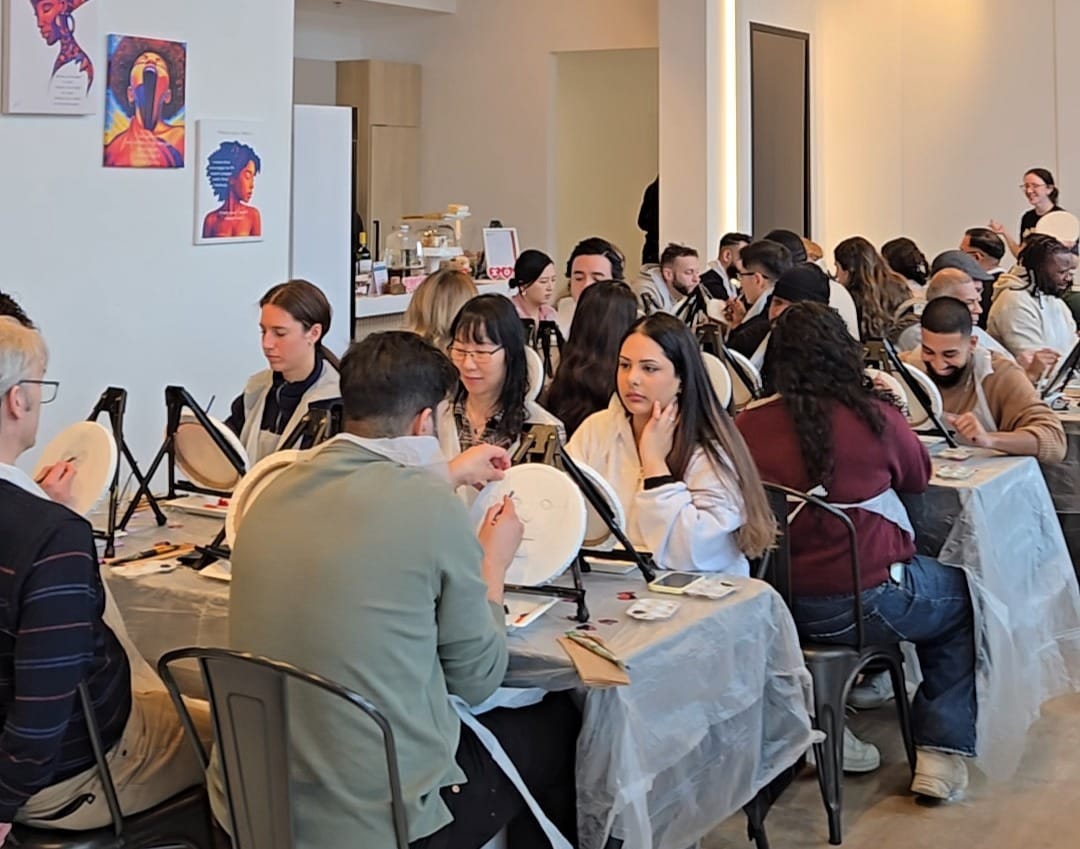 Guests painting together at a community-focused paint night in Toronto